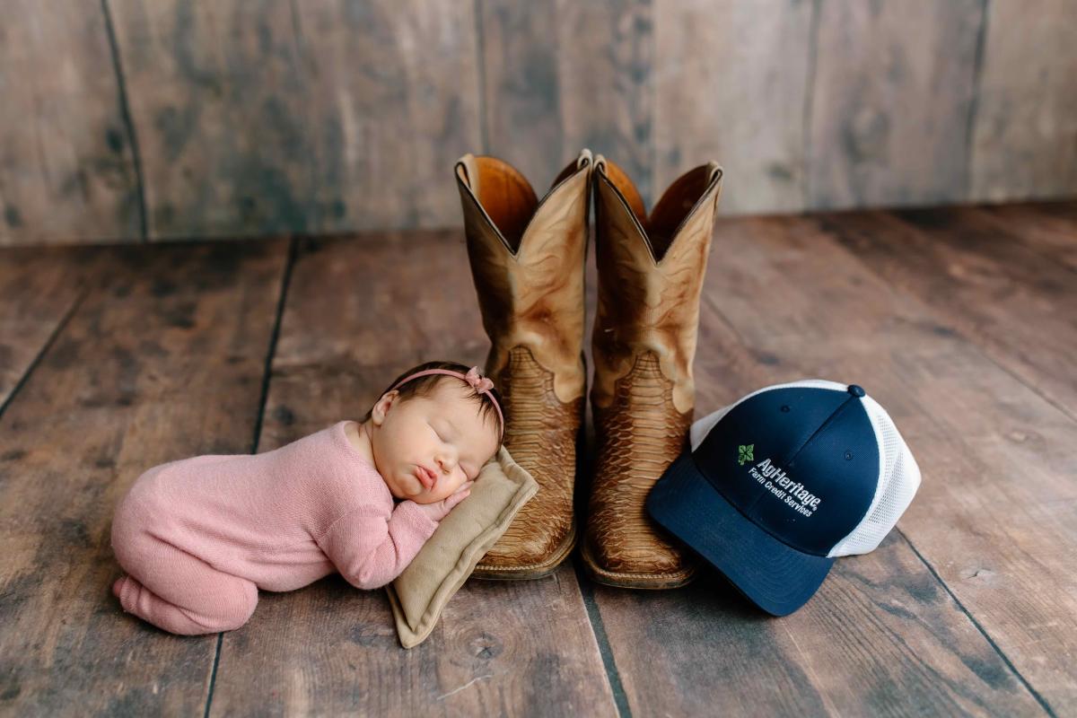 AgHeritage is very near and dear to our hearts. The Pocahontas branch is wonderful to us and our farm! We snapped a photo at newborn session with dads hat supporting ag heritage