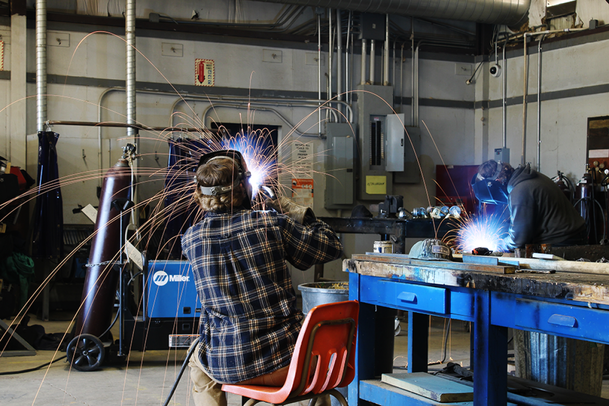 Student welders in the Advanced Mechanics class at Hillcrest High School in Strawberry